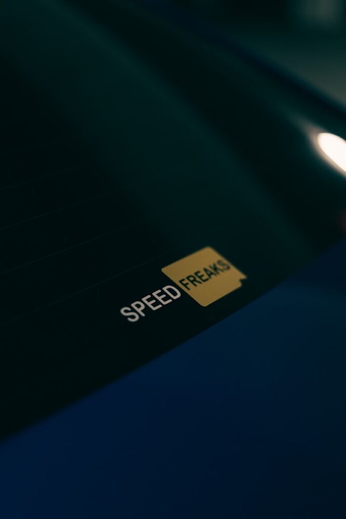 A close up of a speed freak sticker on a car